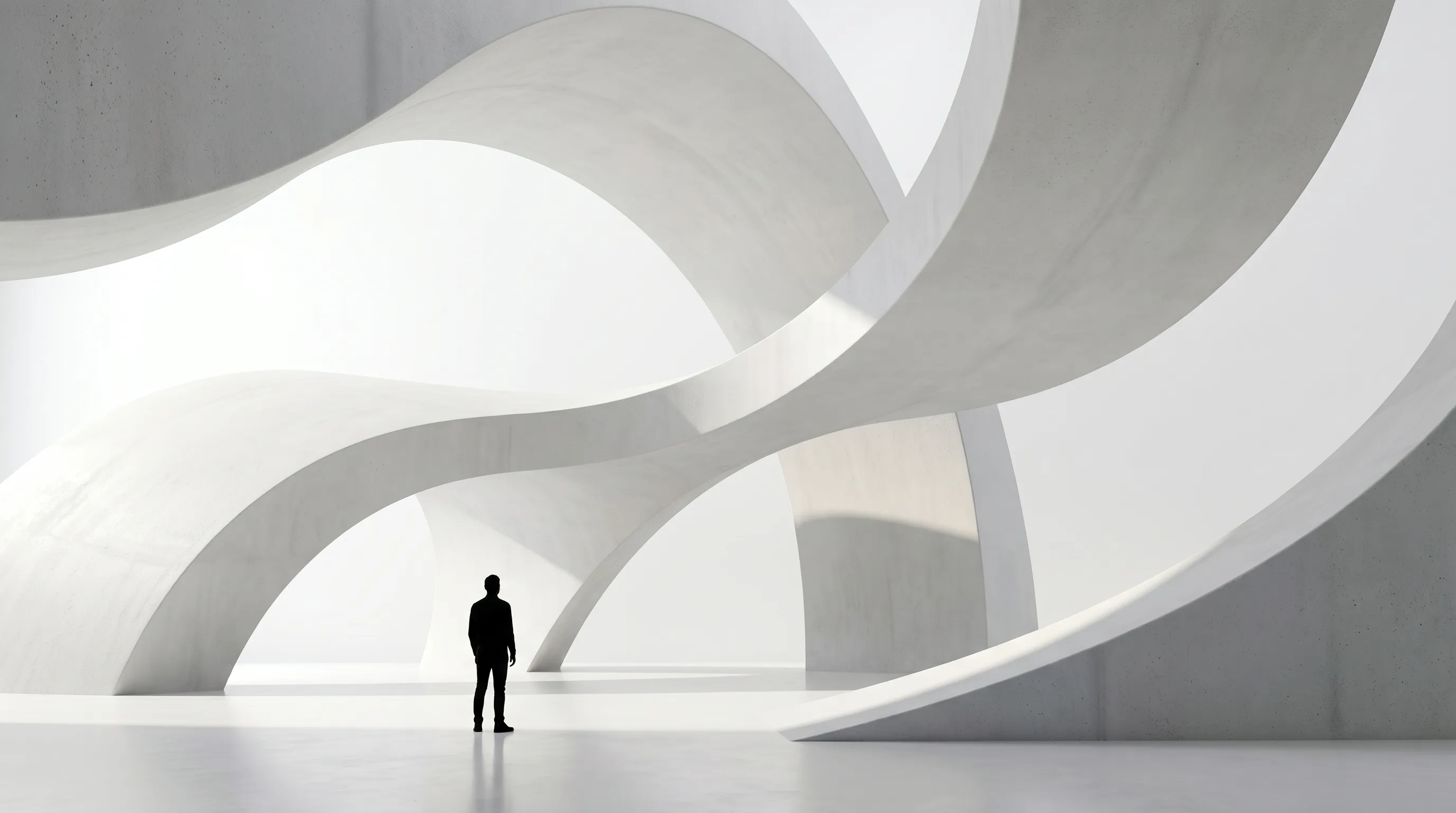 Formas curvas de concreto blanco que evocan el símbolo de VIRAND.